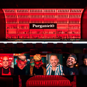 Fachada interna do Purgatório Bar com balcão iluminado e fotos dos bartenders convidados para o evento Guest Bartender 2026.